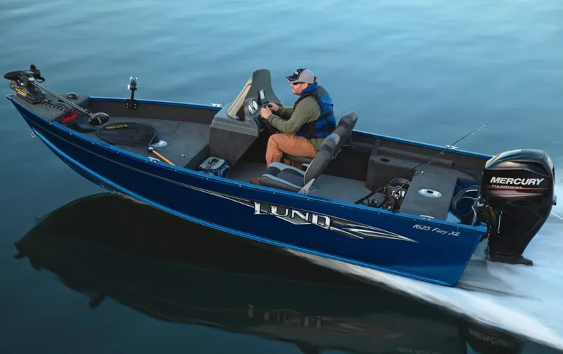 Slide: The Image of 2018 Lund 1625 Fury XL SS boat on trailer in parking lot, sunny day. - 0