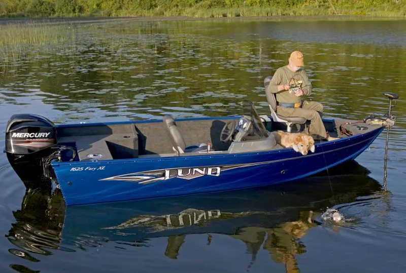 Slide: The Image of 2018 Lund 1625 Fury XL SS boat on trailer in parking lot. - 2