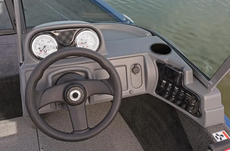 Slide: The Image of Manufacturer Provided Image: 2018 Lund 1625 Fury XL SS boat on a calm lake with a man and a dog. - 5