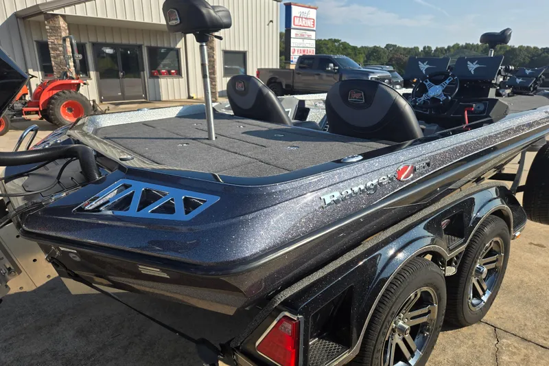 Slide: The Image of 2020 Ranger Z521L boat with sleek design, parked outdoors near a building. - 18
