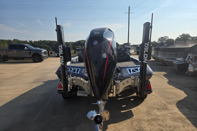 Slide: The Image of 2020 Ranger Z521L boat with Talon anchors, parked outdoors on a sunny day. - 19