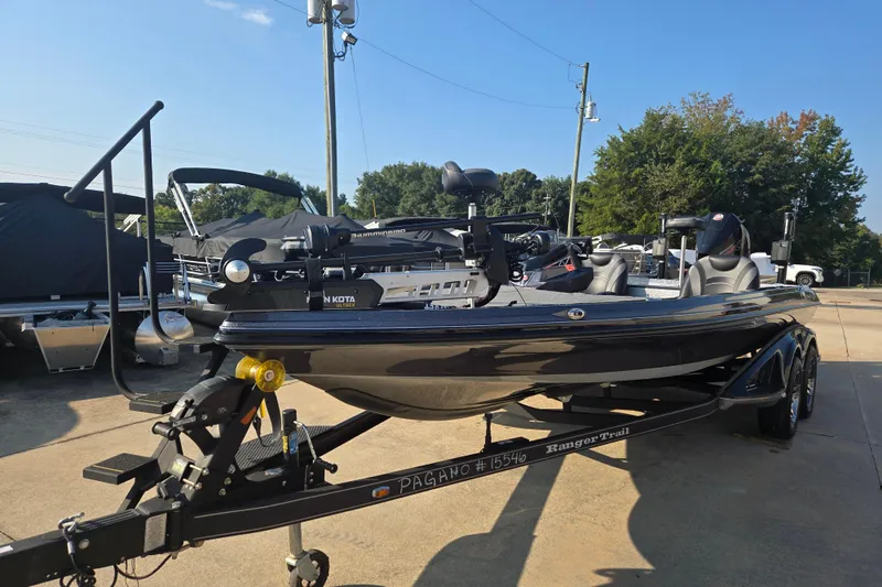Slide: The Image of 2020 Ranger Z521L boat on trailer, parked outdoors under clear sky. - 2