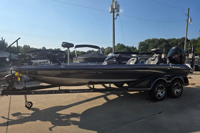 Slide: The Image of 2020 Ranger Z521L boat on trailer, parked outdoors under clear sky. - 3