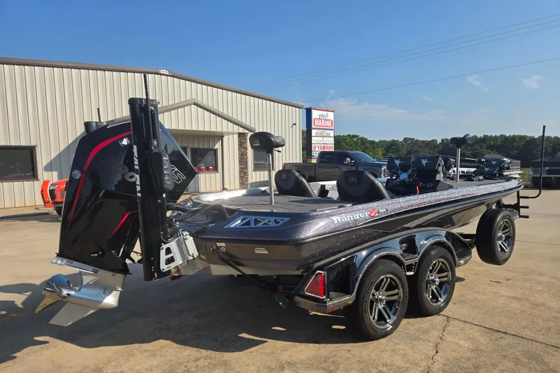 Slide: The Image of 2020 Ranger Z521L boat on trailer, parked outside a marine dealership. - 4