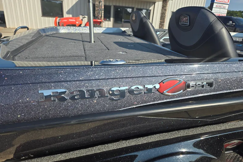 Slide: The Image of 2020 Ranger Z521L boat with glittery finish, featuring logo and seating area. - 7