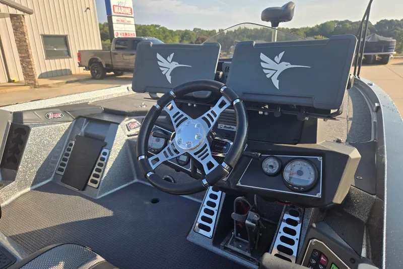 Slide: The Image of 2020 Ranger Z521L boat dashboard with steering wheel and electronic displays. - 9