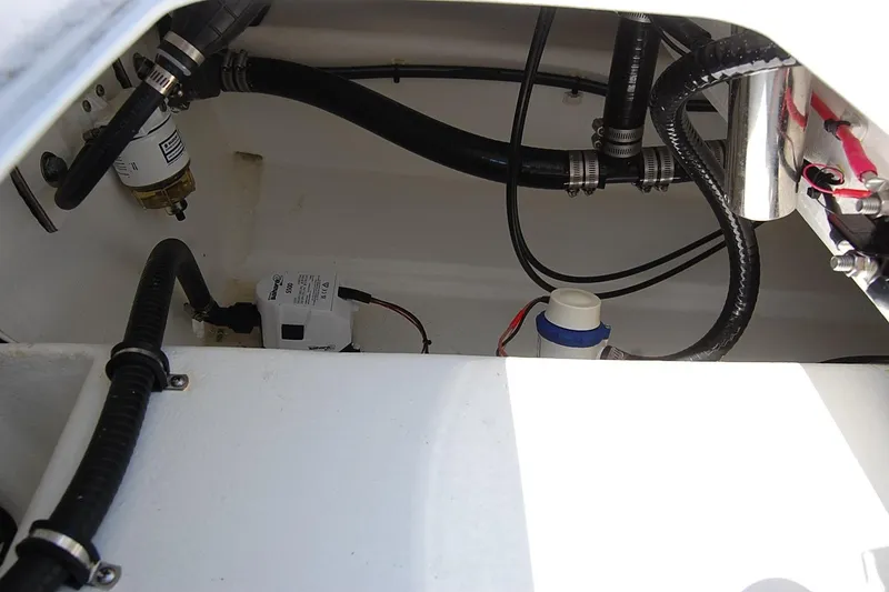 Slide: The Image of Interior view of TEXAR 16 (2026) boat engine compartment with hoses and components. - 20