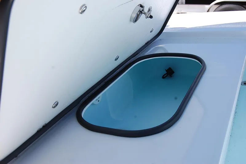 Slide: The Image of Open storage compartment on 2026 TEXAR 16 boat, featuring a sleek design. - 22