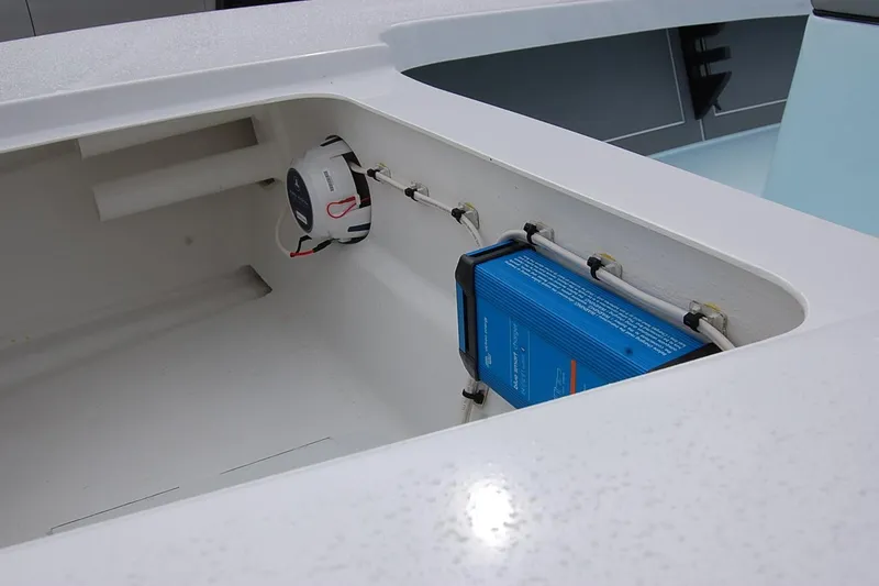 Slide: The Image of Interior view of a TEXAR 16 (2026) boat compartment with electrical components. - 6