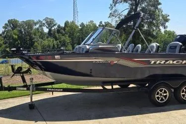 Slide: The Image of 2019 Tracker Targa V-18 Combo boat on trailer, parked outdoors. - 4