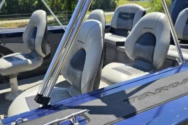 Slide: The Image of 2019 Tracker Targa V-18 Combo boat interior with gray seating and chrome accents. - 5