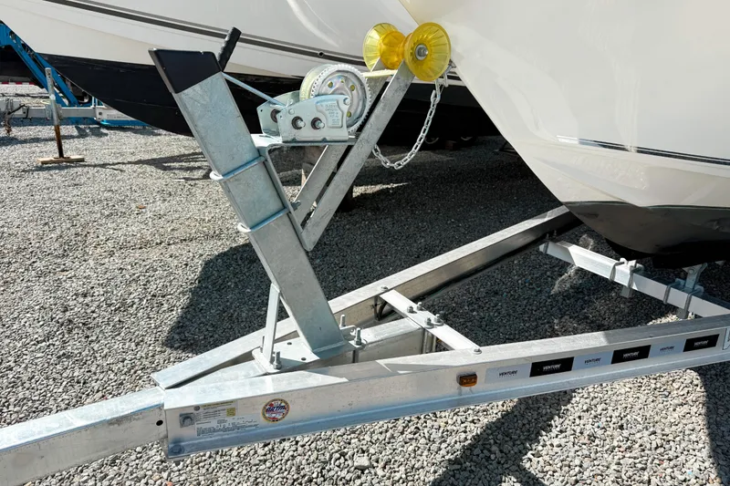 Slide: The Image of Trailer hitch of a 2021 Key West 203 FS boat on gravel surface. - 15