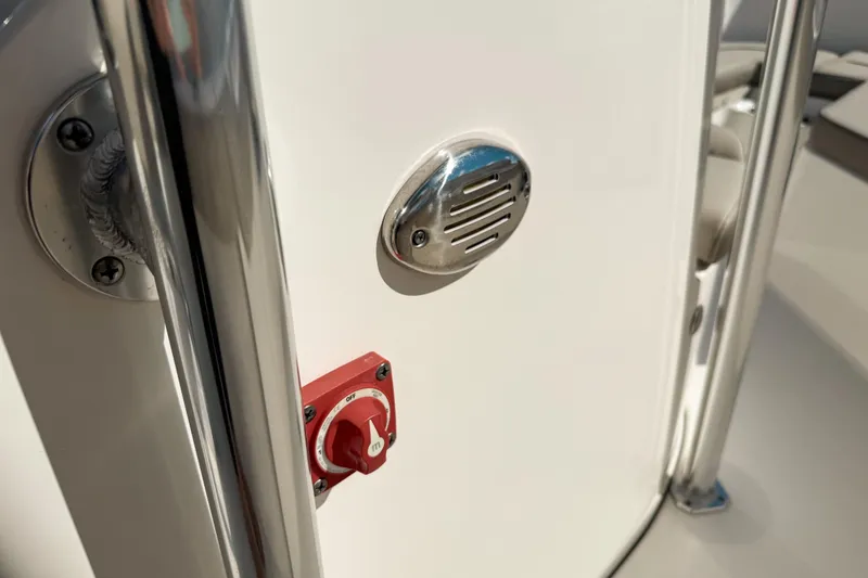 Slide: The Image of 2021 Key West 203 FS boat detail with red switch and metal vent. - 21
