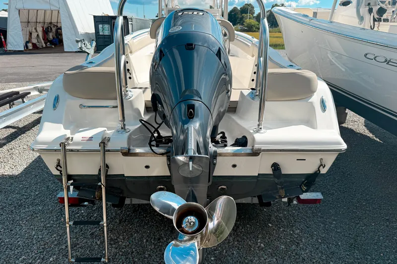Slide: The Image of 2021 Key West 203 FS boat rear view with outboard motor and ladder. - 3