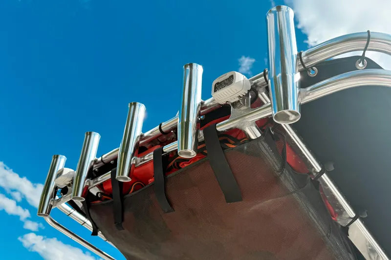 Slide: The Image of Stainless steel rod holders on 2021 Key West 203 FS boat against blue sky. - 8