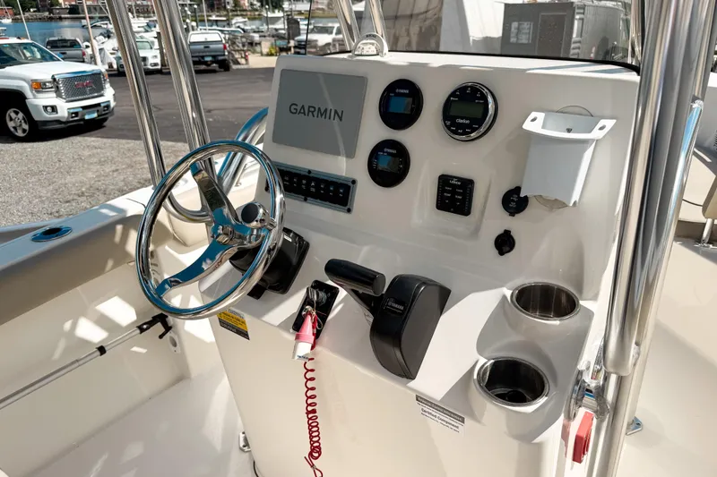 Slide: The Image of 2021 Key West 203 FS boat dashboard with Garmin navigation system and controls. - 9