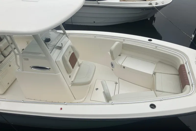 Slide: The Image of 2024 Cobia 280 Center Console boat with spacious seating and sleek design. - 3