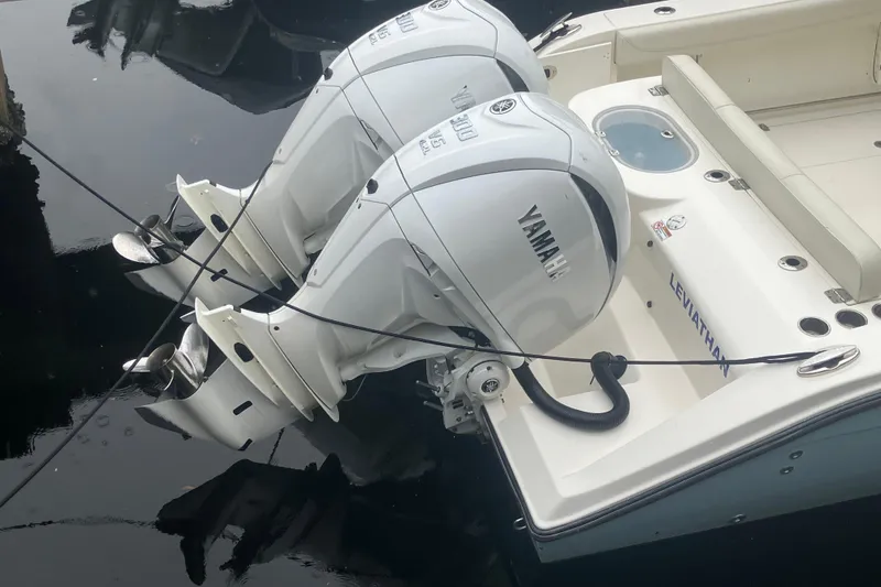 Slide: The Image of 2024 Cobia 280 Center Console with dual Yamaha outboard engines. - 5