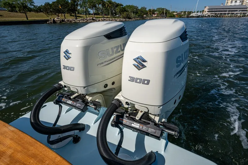 Slide: The Image of Twin Suzuki 300 outboard engines on a 2019 Custom Carolina Custom Express boat. - 27