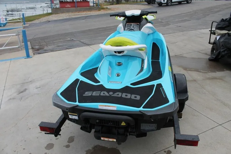 Slide: The Image of 2015 Sea-Doo GTI SE 155 jet ski on trailer, parked near waterfront. - 3