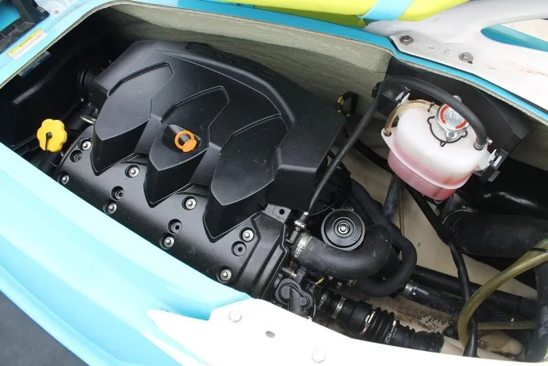 Slide: The Image of 2015 Sea-Doo GTI SE 155 engine compartment with visible components and fluid reservoir. - 8