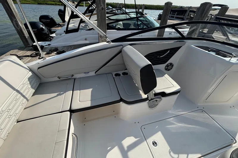Slide: The Image of 2024 Sea Ray SPX 210 Outboard boat interior with comfortable seating and sleek design. - 8