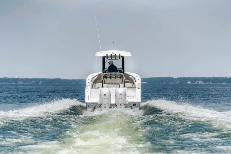 Slide: The Image of 2026 Sea Hunt Gamefish 25 cruising on open water, rear view. - 1