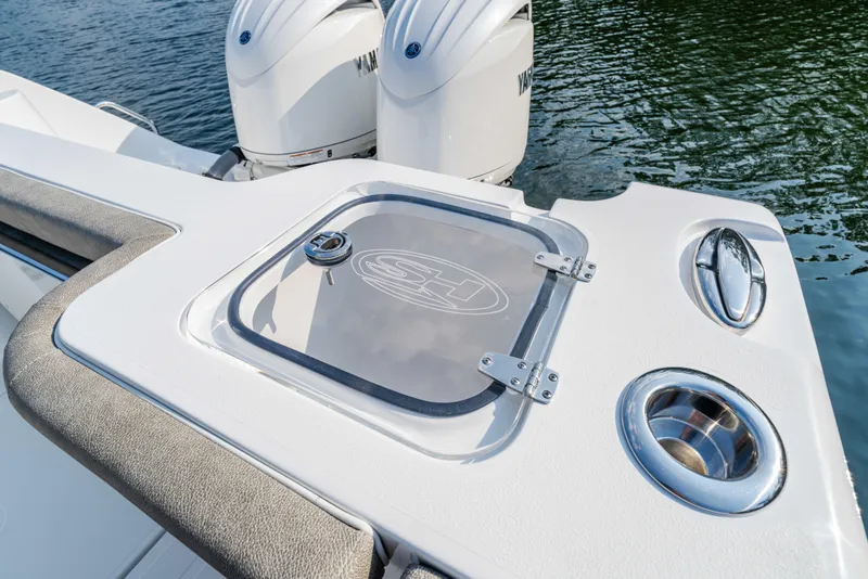 Slide: The Image of 2026 Sea Hunt Gamefish 25 boat with dual Yamaha engines and sleek deck design. - 11