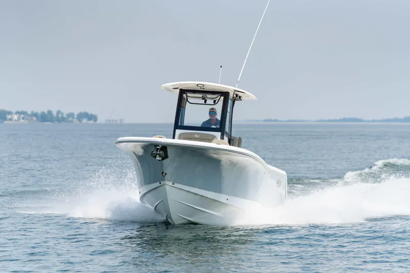 Slide: The Image of 2026 Sea Hunt Gamefish 25 cruising on open water, showcasing sleek design and performance. - 22
