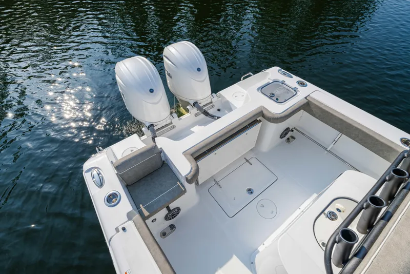 Slide: The Image of 2026 Sea Hunt Gamefish 25 boat with dual engines on calm water. - 8
