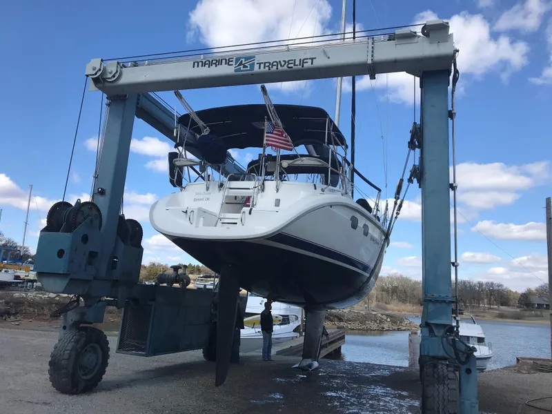 Slide: The Image of Hunter 376 sailboat from 1997 docked at a marina with other boats. - 15