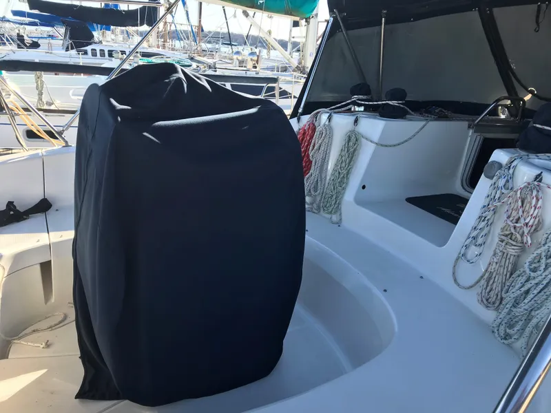 Slide: The Image of Luxurious interior of a 1997 Hunter 376 sailboat with beige seating and nautical decor. - 19