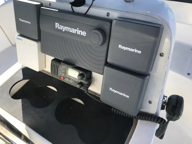 Slide: The Image of 1997 Hunter 376 yacht interior kitchen with stove, sink, and seating area. - 21