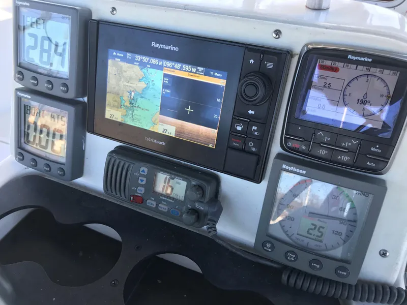 Slide: The Image of Interior of a 1997 Hunter 376 sailboat with cozy seating and nautical decor. - 22