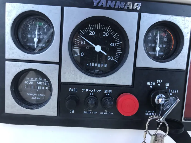 Slide: The Image of Interior of a 1997 Hunter 376 sailboat with wood paneling and beige seating. - 23