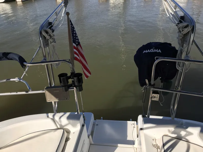 Slide: The Image of Cozy interior of a 1997 Hunter 376 sailboat with plush seating and nautical decor. - 24