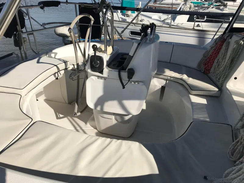 Slide: The Image of 1997 Hunter 376 yacht interior with control panel, TV, and seating area. - 27