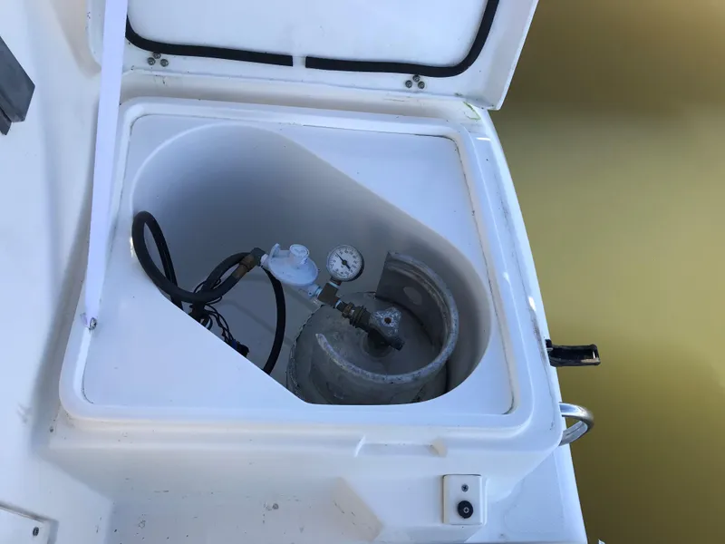 Slide: The Image of Cozy cabin interior of 1997 Hunter 376 sailboat with blue cushions. - 32