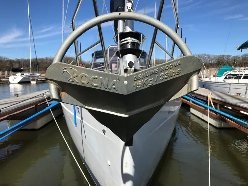 Slide: The Image of Cozy cabin interior of 1997 Hunter 376 sailboat with blue cushions and wooden storage. - 33