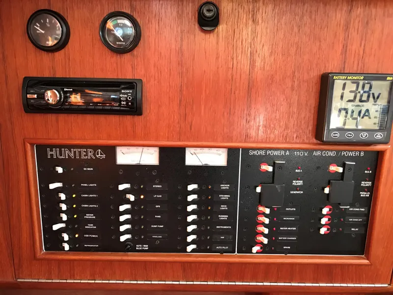 Slide: The Image of Interior of 1997 Hunter 376 sailboat with wooden cabinetry and cozy sleeping area. - 44