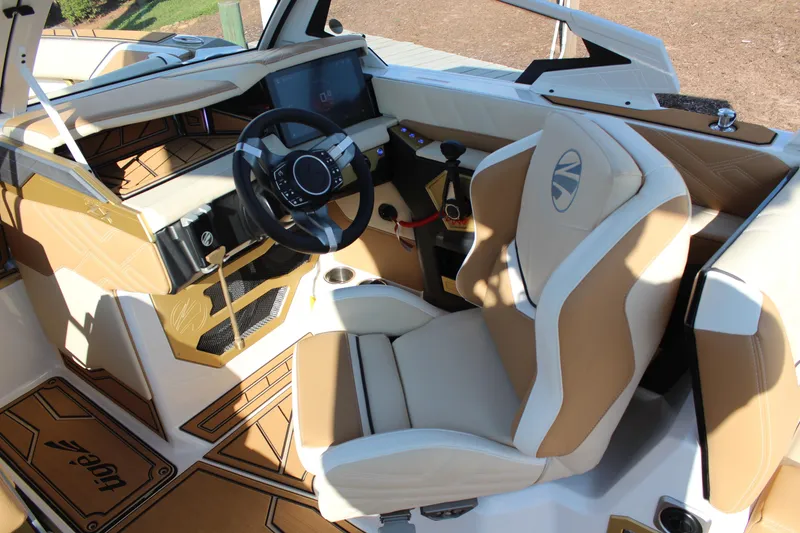 The Image of 2026 Tigé Ultré 25ZX boat interior with modern dashboard and luxurious seating. - 1