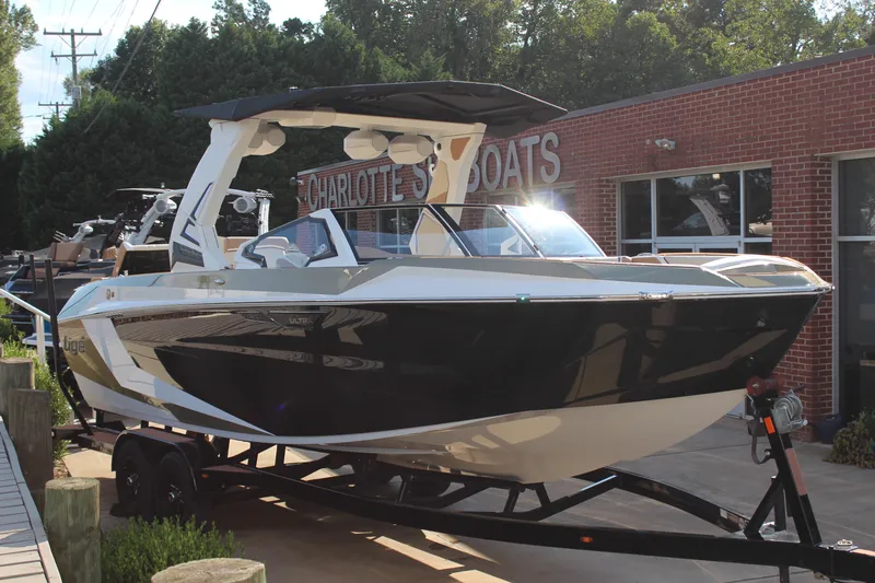 Slide: The Image of 2026 Tigé Ultré 25ZX boat on trailer at Charlotte's Boats dealership. - 11