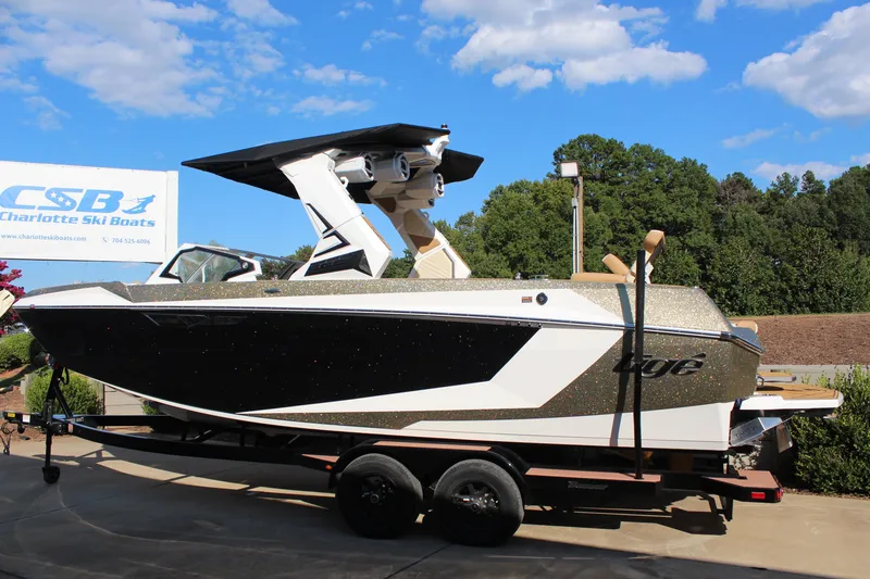 Slide: The Image of 2026 Tigé Ultré 25ZX boat on trailer at Charlotte Ski Boats dealership. - 16