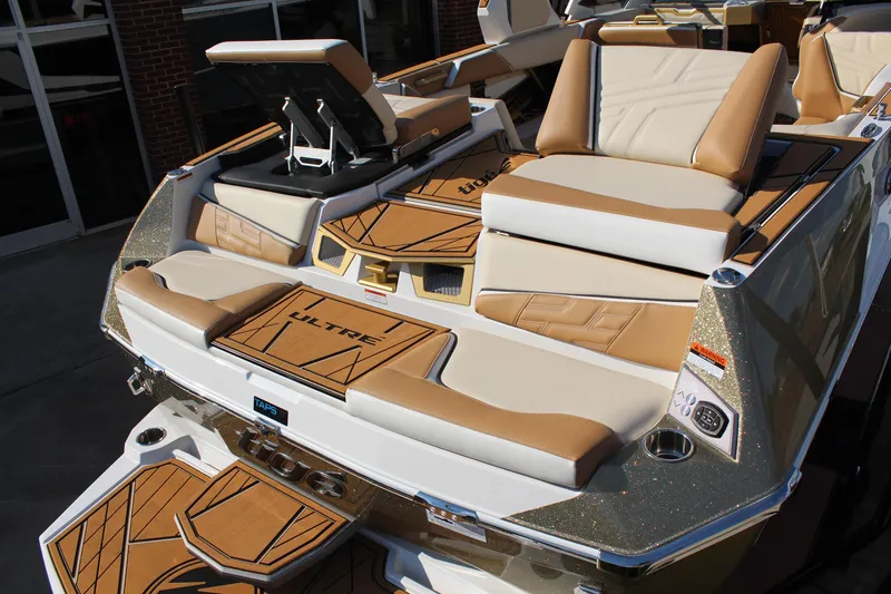 Slide: The Image of 2026 Tigé Ultré 25ZX boat with luxurious tan and white seating and deck design. - 21
