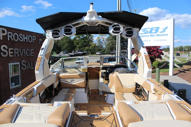 Slide: The Image of 2026 Tigé Ultré 25ZX boat interior with tan seating and advanced audio system. - 22