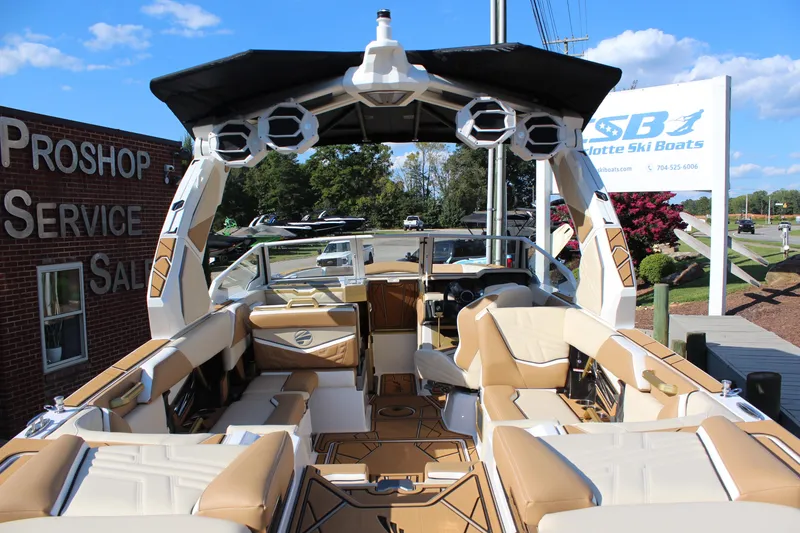 Slide: The Image of 2026 Tigé Ultré 25ZX boat interior with luxury seating and advanced audio system. - 23