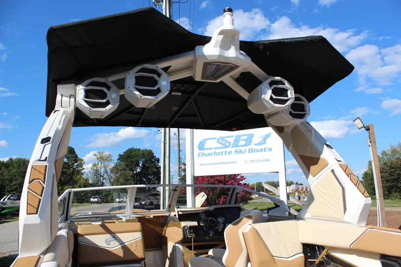 Slide: The Image of 2026 Tigé Ultré 25ZX boat with speakers, showcased at Charlotte Ski Boats dealership. - 31
