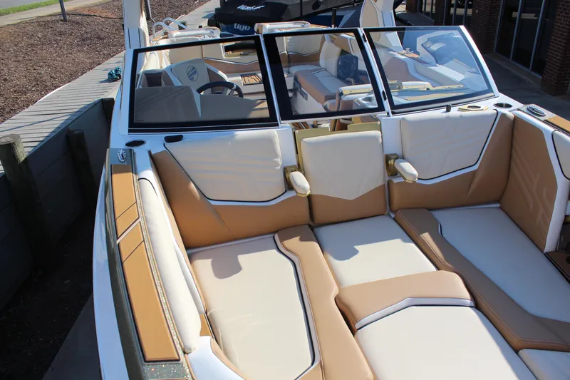 Slide: The Image of 2026 Tigé Ultré 25ZX boat interior with luxurious tan and white seating. - 4