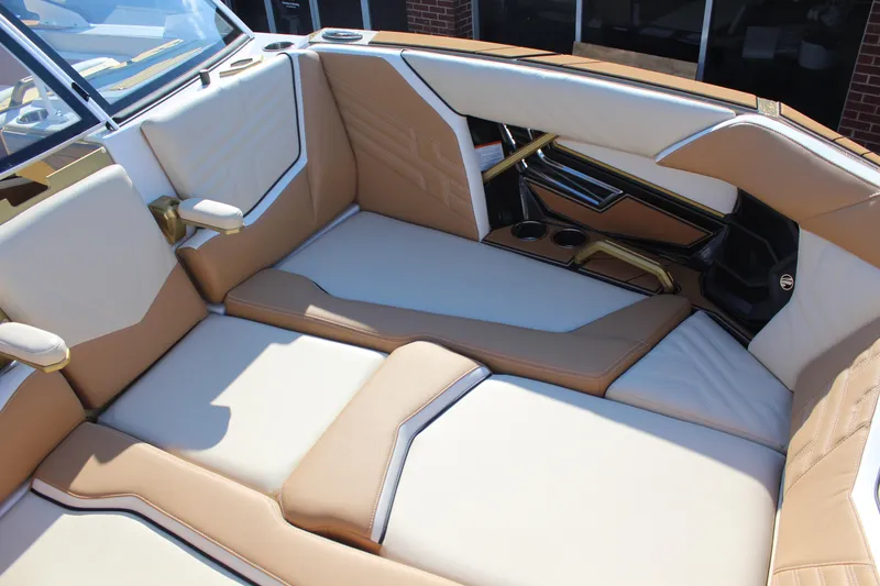 Slide: The Image of Luxurious interior of 2026 Tigé Ultré 25ZX boat with tan and white seating. - 7