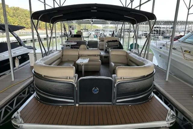 The Image of 2019 Premier 290 Grand View pontoon boat with spacious seating, docked in a marina. - 0